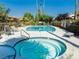 Community pool and hot tub featuring lounge seating and mature landscaping at 4567 Madreperla St, Las Vegas, NV 89121