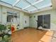 Covered patio featuring tile flooring, an exercise bike, and decorative potted plants at 4567 Madreperla St, Las Vegas, NV 89121