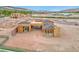 An aerial shot of a home under construction, near a lake and other homes at 54 Bellissima Lago Ct, Henderson, NV 89011
