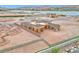An aerial view of a modern home under construction near a lake at 54 Bellissima Lago Ct, Henderson, NV 89011
