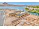 New construction home framing with lake view, showcasing modern design and luxurious waterfront living at 54 Bellissima Lago Ct, Henderson, NV 89011