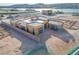 Aerial view of home under construction with a boundary wall and a lake nearby at 54 Bellissima Lago Ct, Henderson, NV 89011