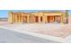 New home construction exterior displaying open framing, offering a glimpse into customizable modern living at 54 Bellissima Lago Ct, Henderson, NV 89011