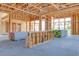 Interior framing during new home construction, highlighting large window placements and modern living spaces at 54 Bellissima Lago Ct, Henderson, NV 89011