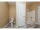 Full bathroom featuring a tub, toilet, and plank flooring at 5676 Bettors Luck Ct, Las Vegas, NV 89122