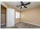 Cozy bedroom with a lighted ceiling fan and a window providing natural light at 5676 Bettors Luck Ct, Las Vegas, NV 89122