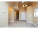 Spacious entryway featuring tile flooring and a view of the staircase at 5676 Bettors Luck Ct, Las Vegas, NV 89122