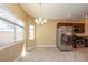 Open kitchen with stainless steel appliances, granite counters, and natural light at 5676 Bettors Luck Ct, Las Vegas, NV 89122