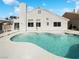 Private backyard pool with a serene atmosphere and ample space for relaxation and entertainment at 676 Covina Dr, Henderson, NV 89002