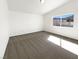 Bright bedroom with plush carpeting and a large window, offering comfort and natural light at 676 Covina Dr, Henderson, NV 89002