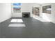 Inviting living area with tile floors, a modern fireplace, and bright windows, perfect for relaxation at 676 Covina Dr, Henderson, NV 89002