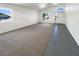 Open-concept living room with abundant natural light, neutral flooring, and a welcoming entrance at 676 Covina Dr, Henderson, NV 89002