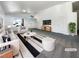 Bright living room features neutral walls, plush seating, and a large rug at 676 Covina Dr, Henderson, NV 89002