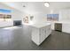 Bright living room featuring tile floors, a fireplace, and white walls, providing a modern and spacious feel at 676 Covina Dr, Henderson, NV 89002