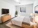 Cozy bedroom with a comfortable bed, contemporary decor, and soft natural lighting creates a serene atmosphere at 676 Covina Dr, Henderson, NV 89002