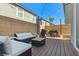 Outdoor patio with lounge seating, grill, and wood deck; a great space for entertaining guests at 6848 Calvitero St, Las Vegas, NV 89149