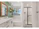Bright bathroom featuring a tub, shower with glass door, and stylish decor at 6848 Calvitero St, Las Vegas, NV 89149