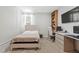 Comfortable bedroom with a decorative headboard, a workspace, and a window with natural light at 6848 Calvitero St, Las Vegas, NV 89149