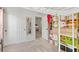 Well-organized bedroom with closet, mirrored wall decor, and a loft bed with storage at 6848 Calvitero St, Las Vegas, NV 89149