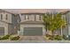 Charming two-story home featuring a well-maintained front yard and a two-car garage at 6848 Calvitero St, Las Vegas, NV 89149