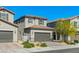 Charming two-story home featuring a well-maintained front yard and a two-car garage at 6848 Calvitero St, Las Vegas, NV 89149