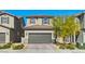 Charming two-story home featuring a well-maintained front yard and a two-car garage at 6848 Calvitero St, Las Vegas, NV 89149
