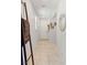 Entryway featuring neutral tile flooring, decorative ladder with throw, and modern decor at 6848 Calvitero St, Las Vegas, NV 89149