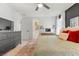 Bright main bedroom with a ceiling fan, dresser, and neutral décor at 6848 Calvitero St, Las Vegas, NV 89149