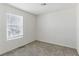 Bedroom with neutral carpet, white walls, natural light and electrical outlets at 6850 Magenta Moon St, North Las Vegas, NV 89086