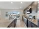 Close-up of the contemporary kitchen showcasing granite countertops, stainless steel appliances, and sleek cabinetry at 6850 Magenta Moon St, North Las Vegas, NV 89086