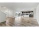 Open-concept living space with modern kitchen, stainless steel appliances and access to an outdoor balcony at 6850 Magenta Moon St, North Las Vegas, NV 89086