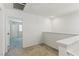 Carpeted loft area with white walls and natural light next to doorframe at 6850 Magenta Moon St, North Las Vegas, NV 89086