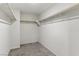 Empty walk-in closet with neutral carpet and a functional layout, providing ample storage space at 6850 Magenta Moon St, North Las Vegas, NV 89086