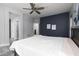 Bedroom boasts neutral paint, ceiling fan, and access to other rooms at 689 Principle Point Ave, Henderson, NV 89012