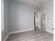 Bedroom featuring neutral walls and gray flooring, with an open doorway at 689 Principle Point Ave, Henderson, NV 89012