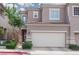Multi-level home featuring neutral paint, well maintained landscaping, and attached two car garage at 689 Principle Point Ave, Henderson, NV 89012
