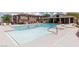 Community pool area with lounge chairs and well-maintained landscaping, perfect for relaxation at 689 Principle Point Ave, Henderson, NV 89012