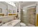 Bathroom featuring vanity, tiled shower with glass door, and decoratively arranged accessories at 7055 Sylvan Oak Dr, Las Vegas, NV 89147