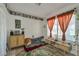 Comfortable bedroom featuring a floor mattress, stylish furniture, and ample natural light at 7055 Sylvan Oak Dr, Las Vegas, NV 89147