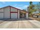 Charming single-story home featuring a covered front entrance and a spacious driveway leading to an attached garage at 7055 Sylvan Oak Dr, Las Vegas, NV 89147
