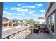 Balcony view of the street featuring neighborhood homes and a blue sky at 7307 Grace Estate Ave, Las Vegas, NV 89113
