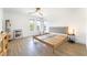 Bright bedroom featuring a bed frame, contemporary decor, and three windows at 7307 Grace Estate Ave, Las Vegas, NV 89113