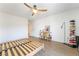 Simple bedroom featuring a ceiling fan, bed frame, and stylish decor at 7307 Grace Estate Ave, Las Vegas, NV 89113
