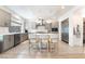 Modern kitchen with gray cabinetry, stainless steel appliances, and a center island with bar stool seating at 7307 Grace Estate Ave, Las Vegas, NV 89113