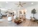 Open-concept living area showcasing a modern kitchen and bright living room at 7307 Grace Estate Ave, Las Vegas, NV 89113