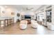 Bright living room with large windows and comfortable seating at 7307 Grace Estate Ave, Las Vegas, NV 89113