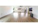 Spacious living room with light wood flooring and lots of windows providing ample natural light at 7307 Grace Estate Ave, Las Vegas, NV 89113