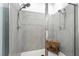 Modern shower with gray tile and dual shower heads offers a luxurious bathing experience at 7307 Grace Estate Ave, Las Vegas, NV 89113