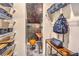 Unique hallway with open shelves, a small desk area, an accent wall, and a compact workspace at 7732 Canon Walk St, Las Vegas, NV 89139