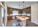 Stylish kitchen with stainless steel appliances, a center island with seating, and ample cabinet space at 7732 Canon Walk St, Las Vegas, NV 89139
